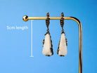Side profile moonstone earrings length and structure silver drop earrings detail