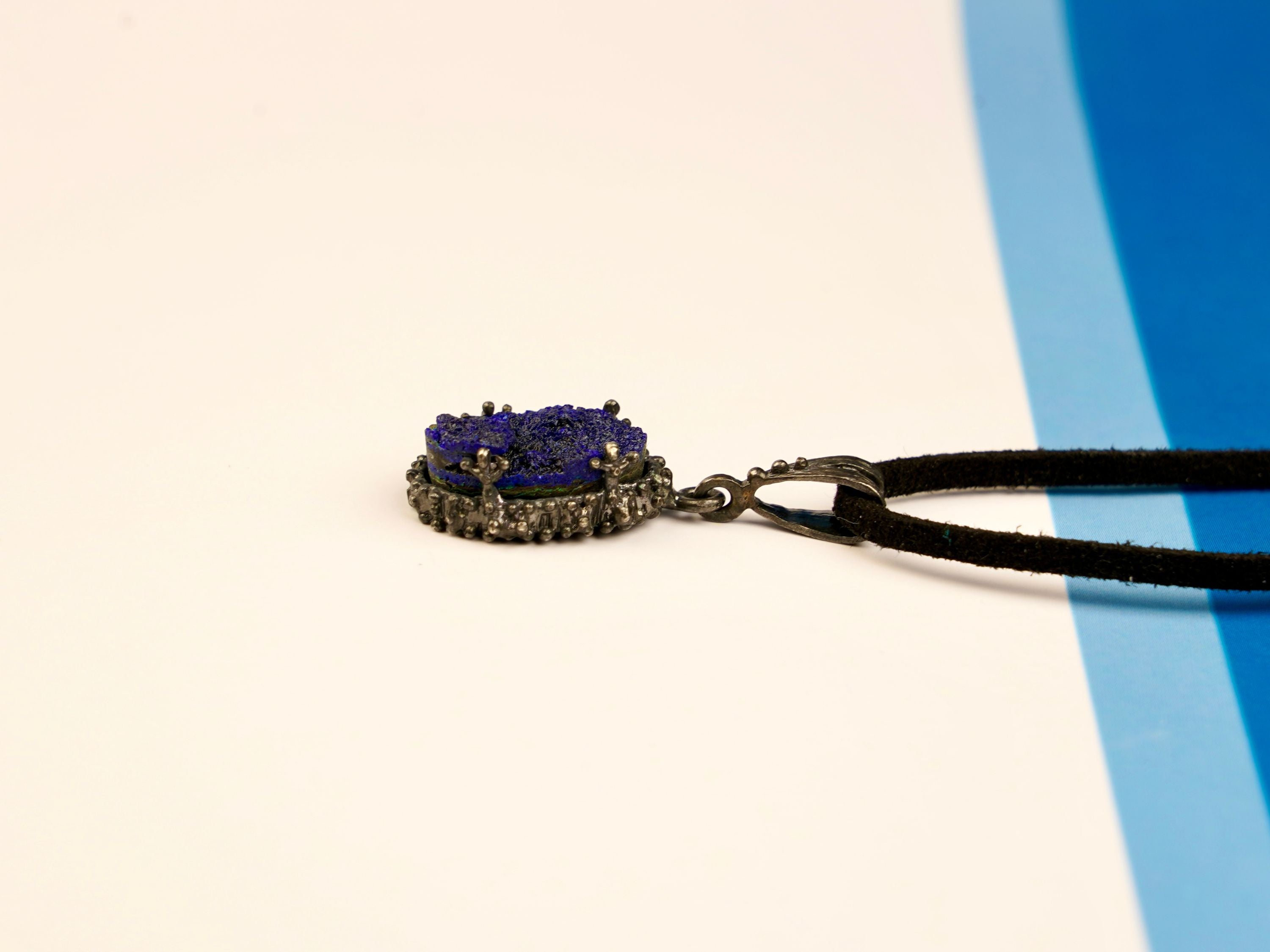 lapis lazuli pendant side profile, raw stone thickness and silver setting detail