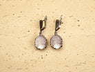 backside of rose quartz earrings, secure leverback sterling silver detail
