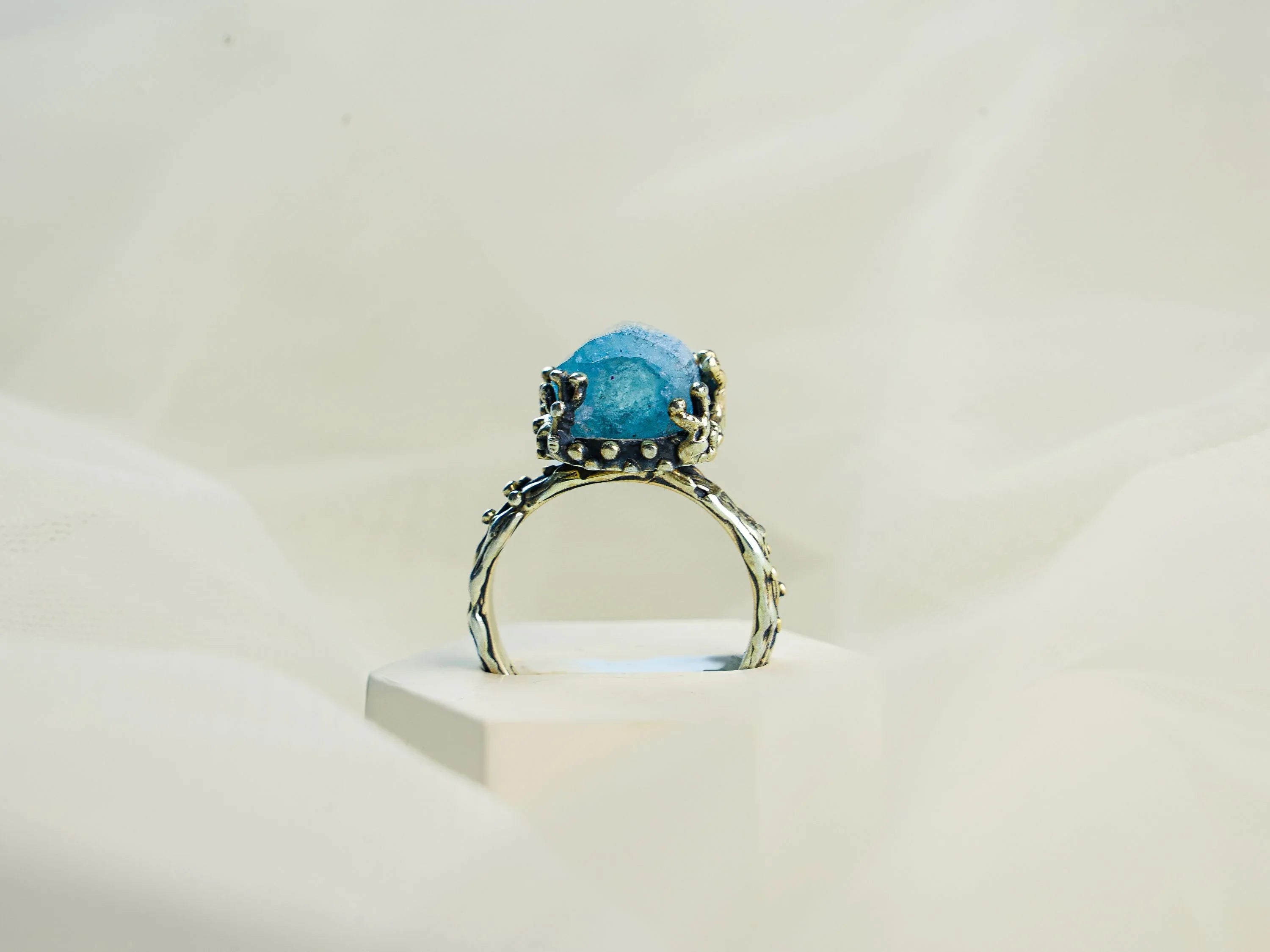 Aquamarine ring front standing view gemstone and band structure