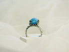 Aquamarine ring front standing view gemstone and band structure