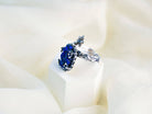 Handmade bohemian lapis lazuli jewelry displayed on a minimalist white aesthetic pedestal