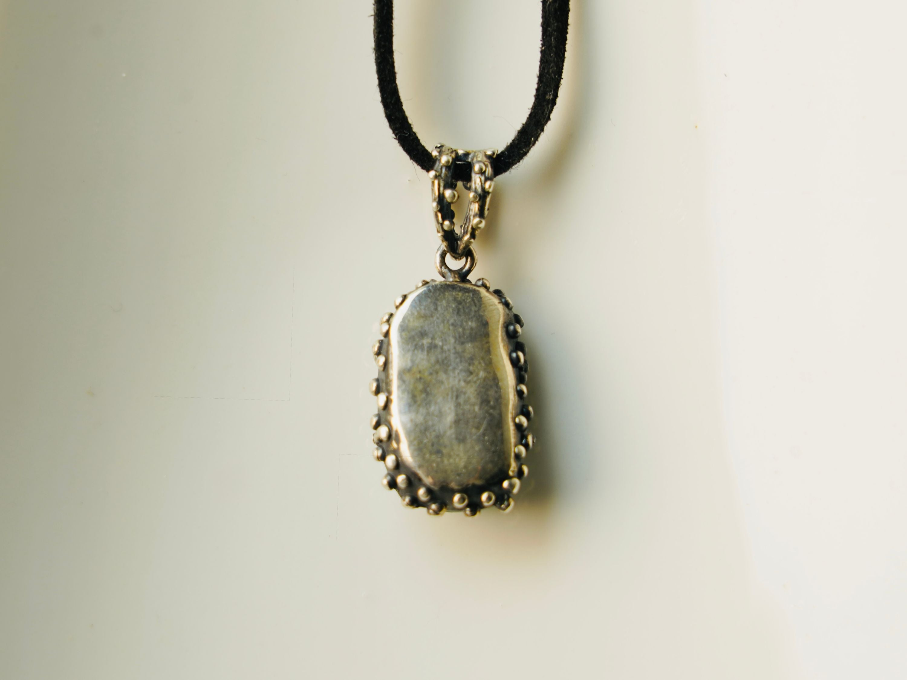 Backside aquamarine pendant silver craftsmanship detail rear view necklace
