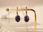 Alternative close up lapis lazuli earrings textured blue stone macro detail