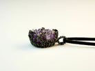 low angle amethyst crystal pendant, raw gemstone structure detail