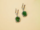 Alternative close up jade earrings green gemstone macro detail silver setting