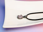Rose quartz necklace detailed texture soft pink gemstone close up natural pattern