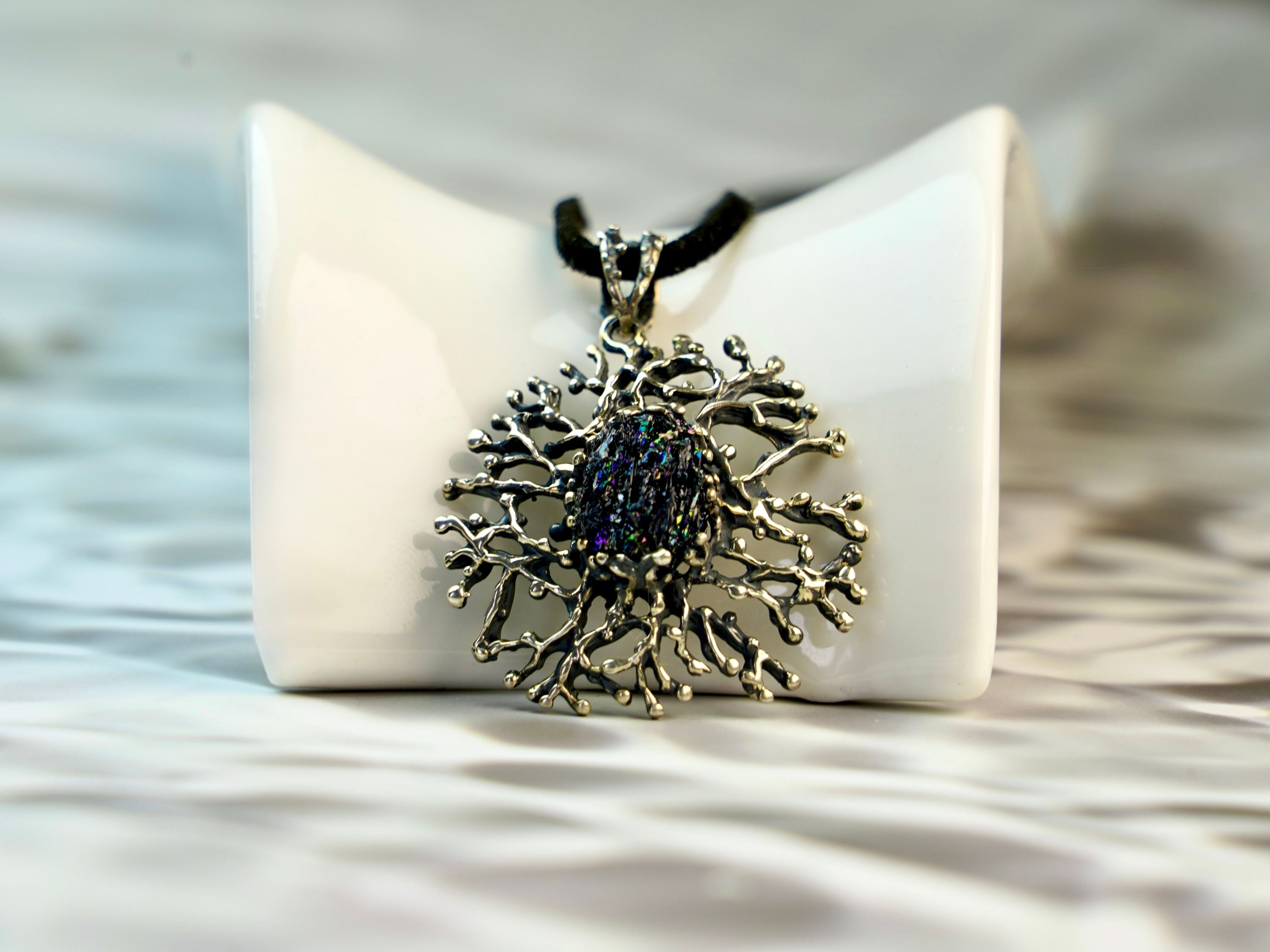 low angle tourmaline pendant, raw crystal structure and metalwork detail