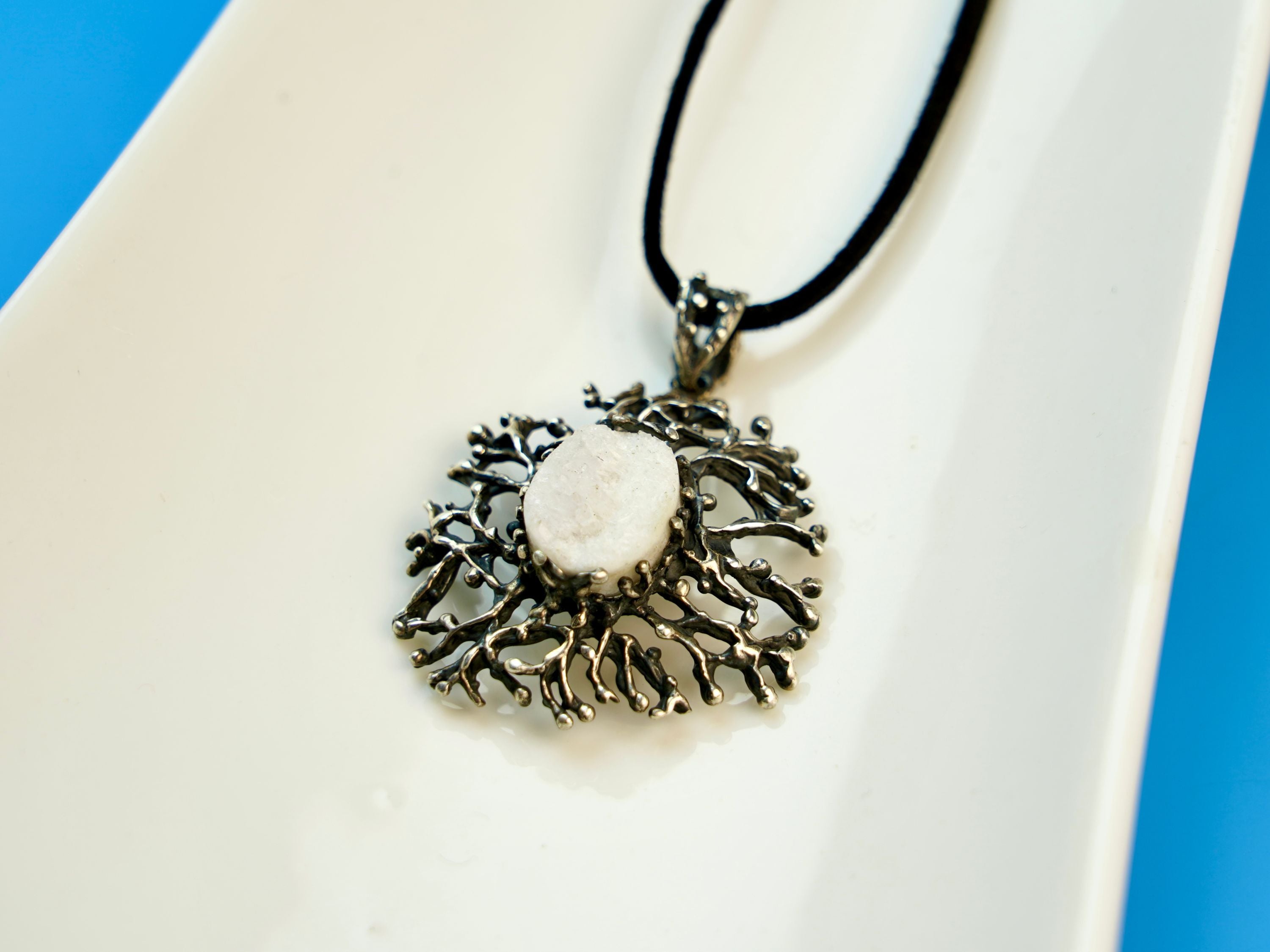moonstone pendant detail view, organic branch-like silver craftsmanship