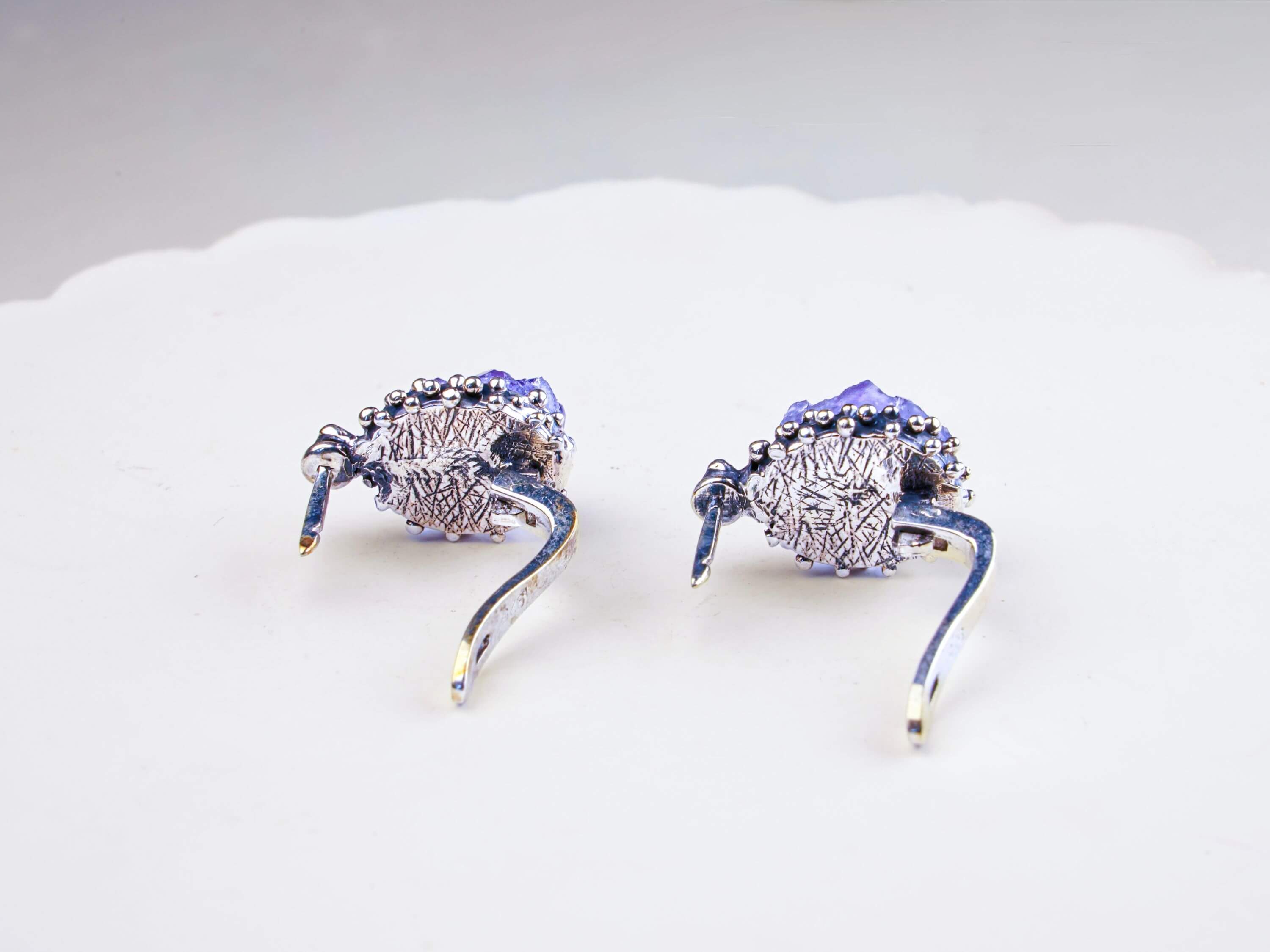 Rear view of the amethyst earring, showcasing the secure 925 sterling silver leverback closure and artisan craftsmanship