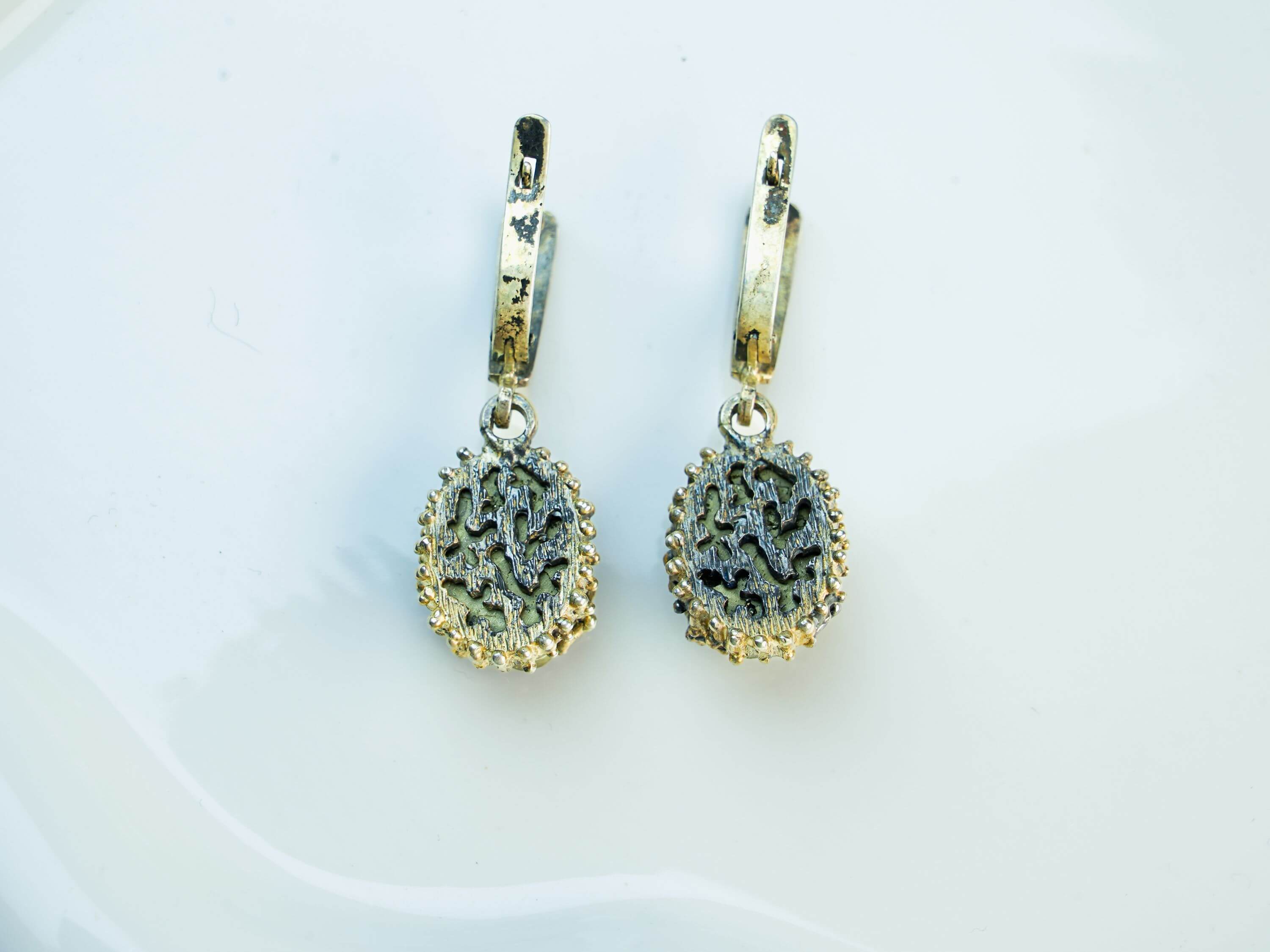 The back of the pyrite earring, showing the 925 sterling silver hallmark and the secure, high-quality leverback closure