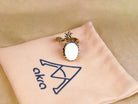 Moonstone ring on pouch branding jewelry presentation aesthetic