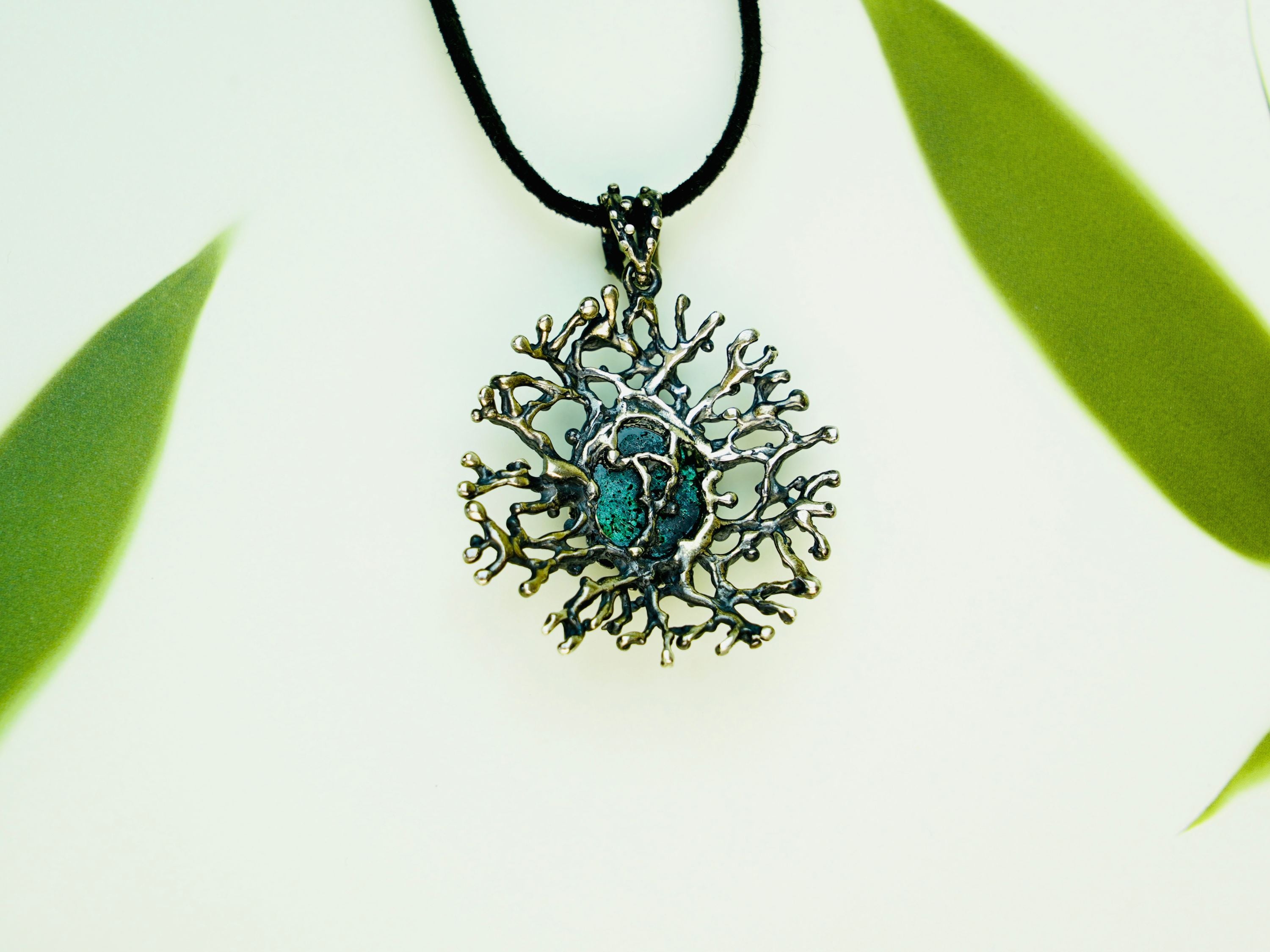 Malachite necklace backside view silver setting detail natural gemstone pendant