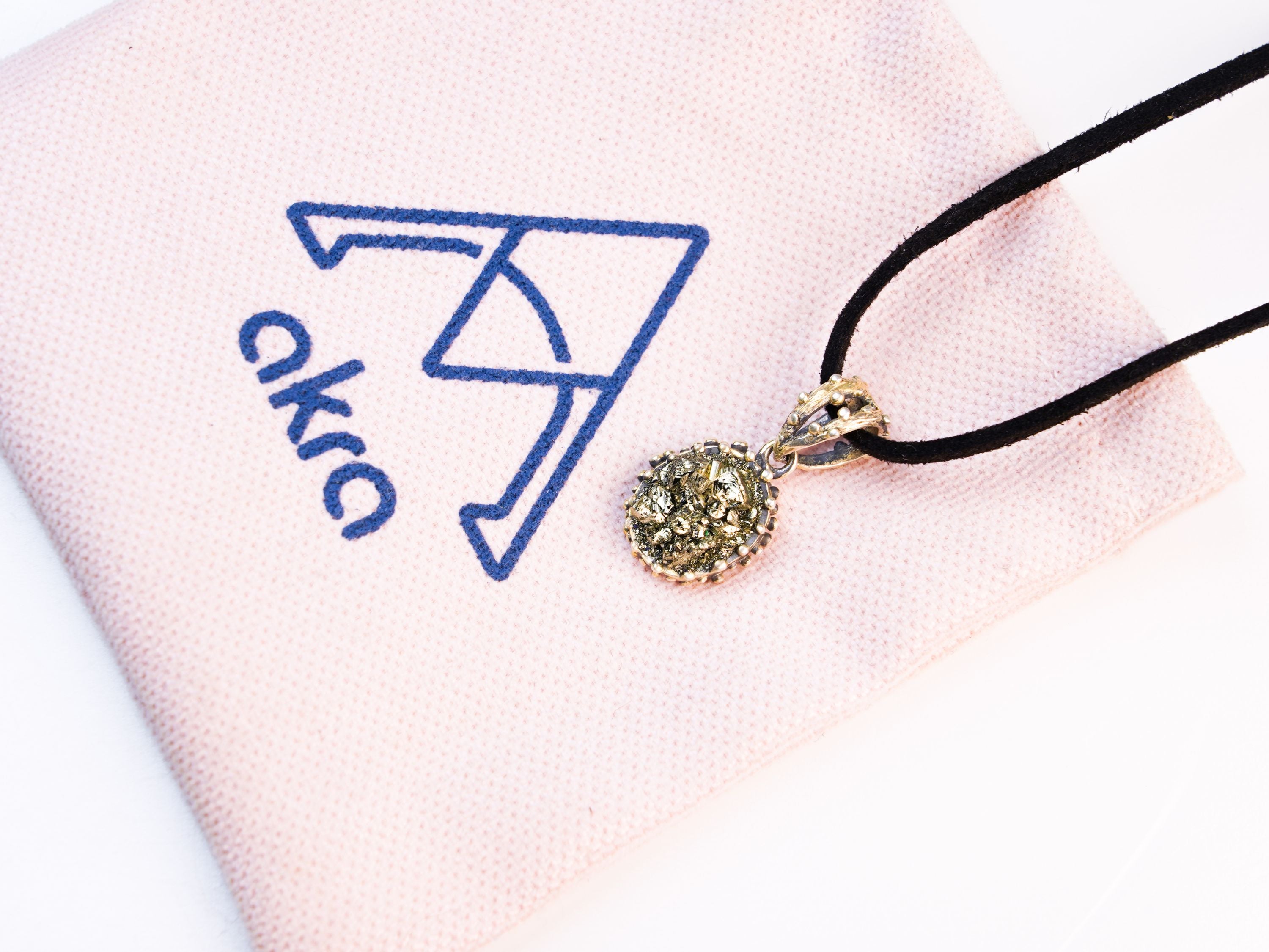 pyrite necklace lifestyle shot elegant gold jewelry akra brand