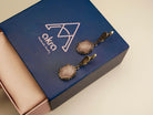 rose quartz earrings lifestyle shot, romantic feminine jewelry aesthetic