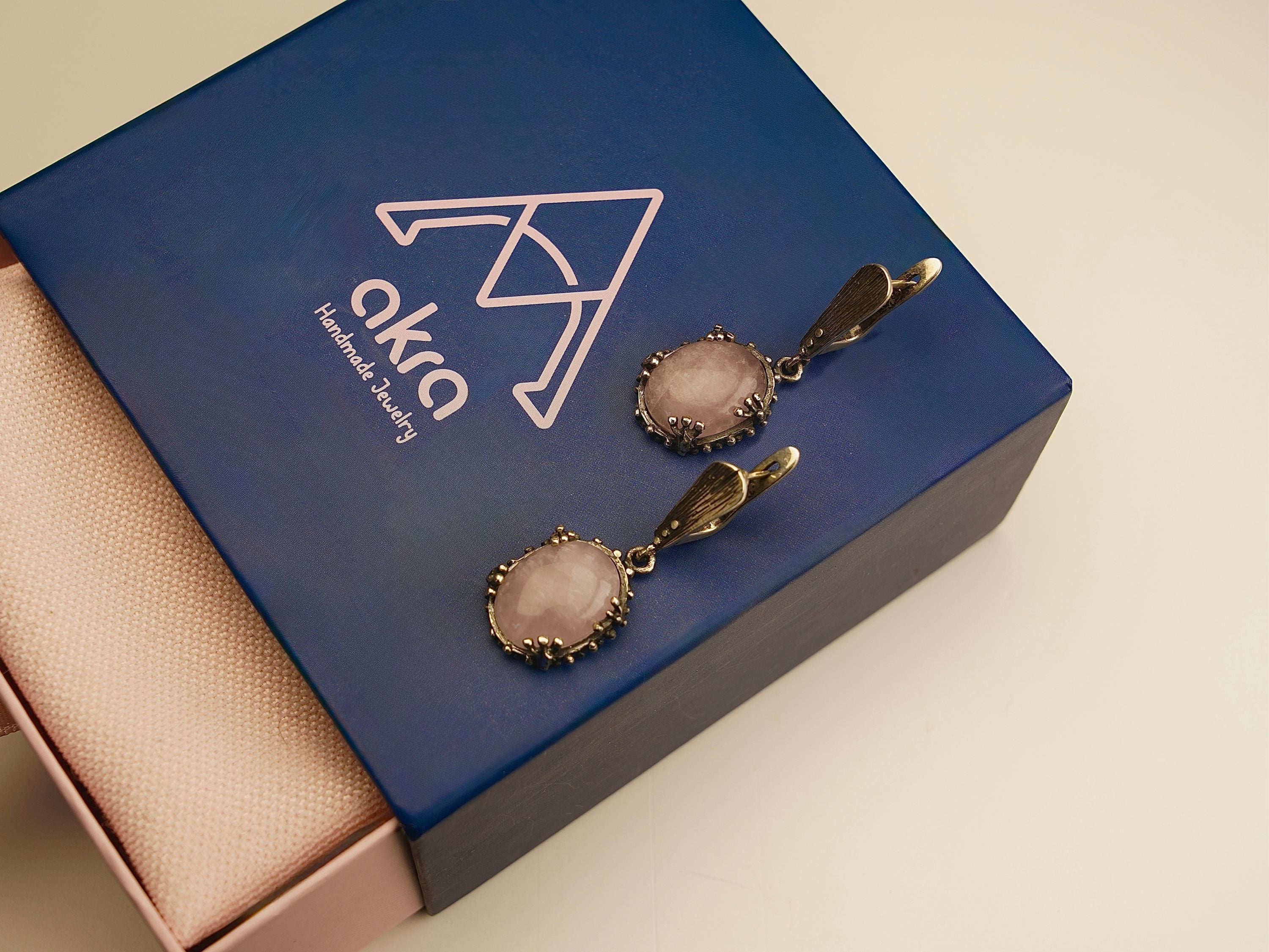 rose quartz earrings lifestyle shot, romantic feminine jewelry aesthetic