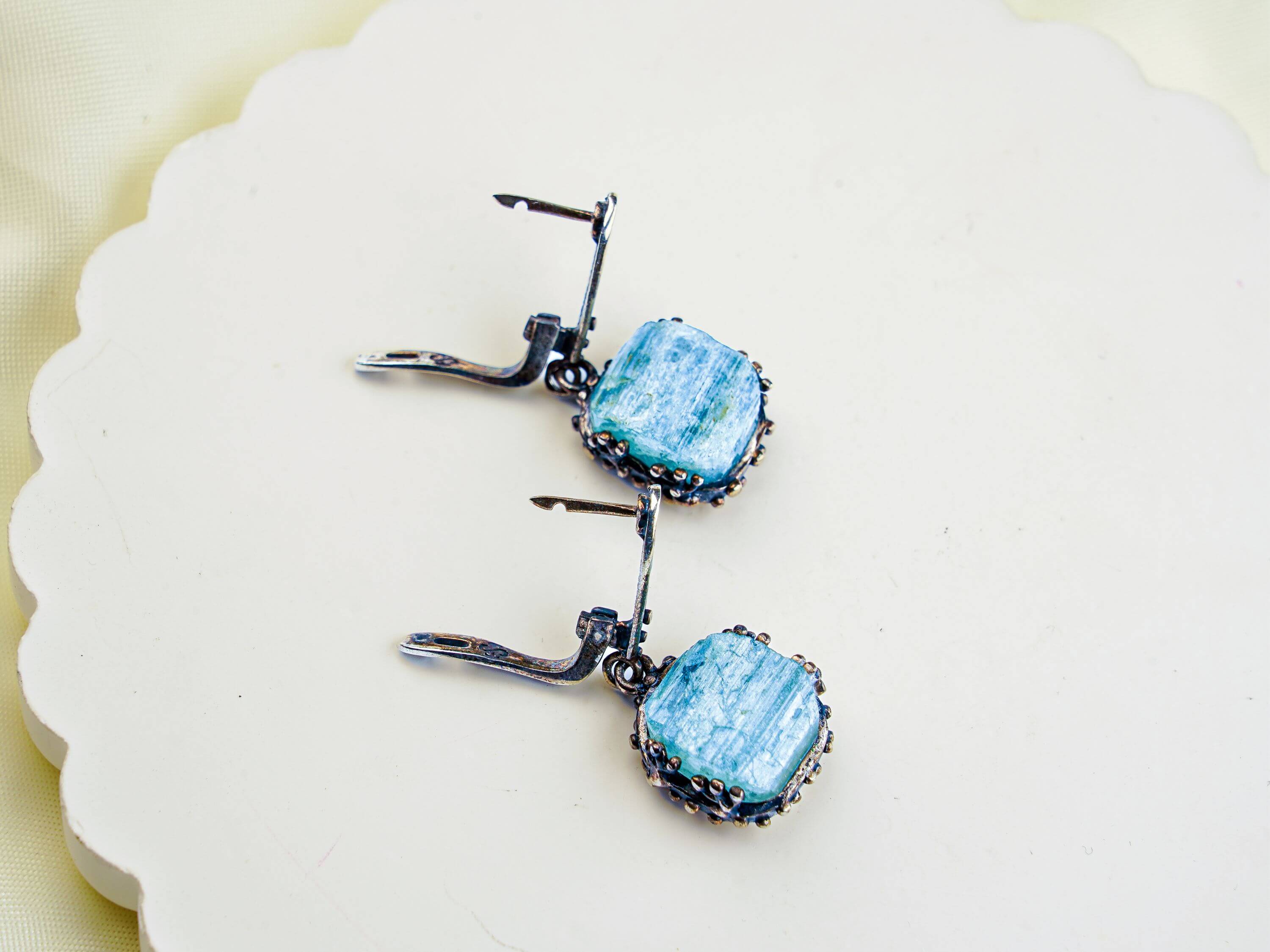 Alternative close up aquamarine earrings raw aqua crystal macro detail variation