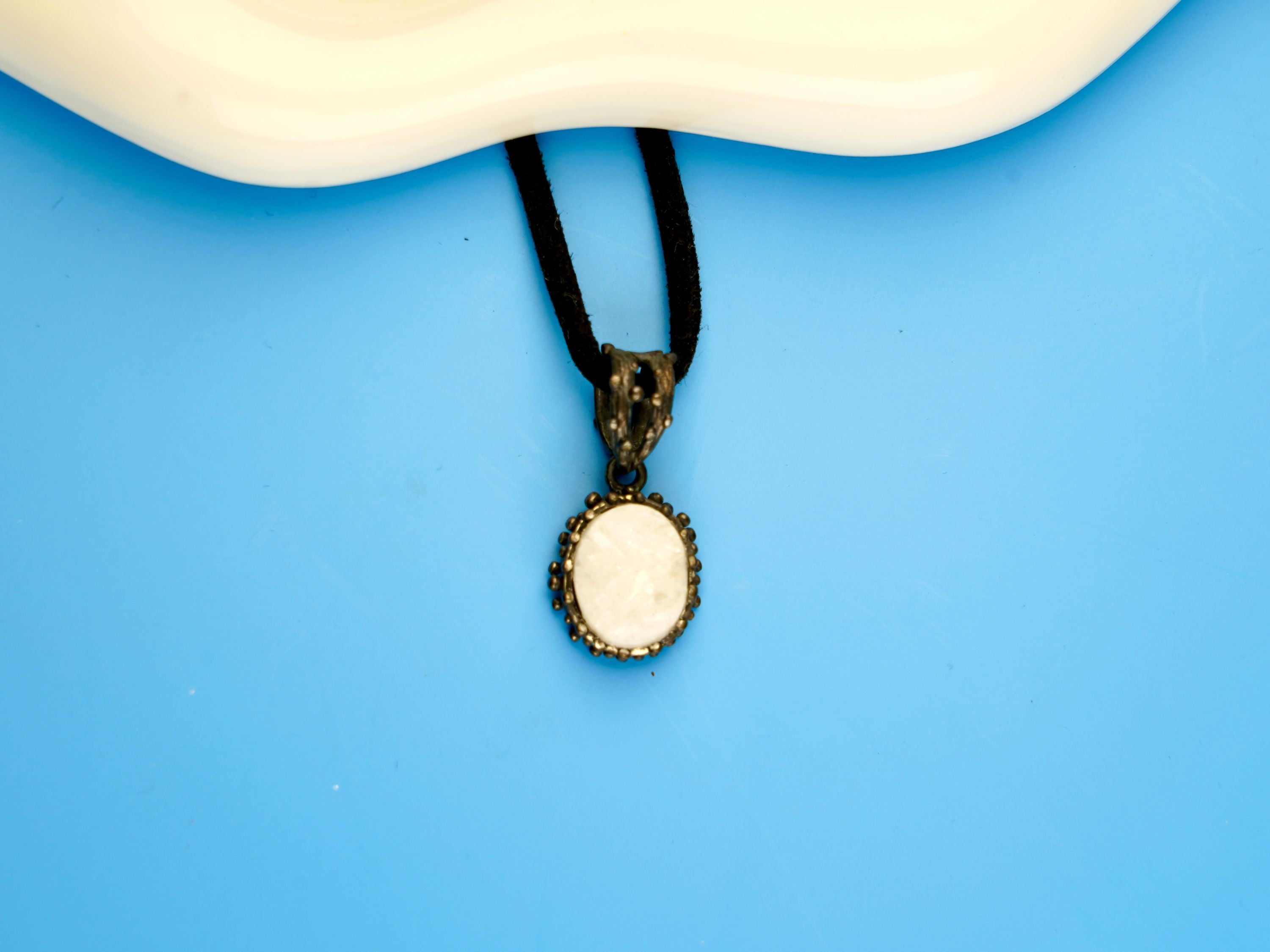 moonstone pendant necklace lifestyle shot, minimal elegant jewelry style