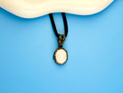 moonstone pendant necklace lifestyle shot, minimal elegant jewelry style