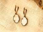 Lifestyle moonstone drop earrings elegant white gemstone jewelry styled composition