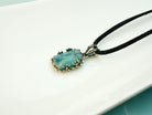 Lifestyle aquamarine necklace blue crystal jewelry minimal aesthetic composition