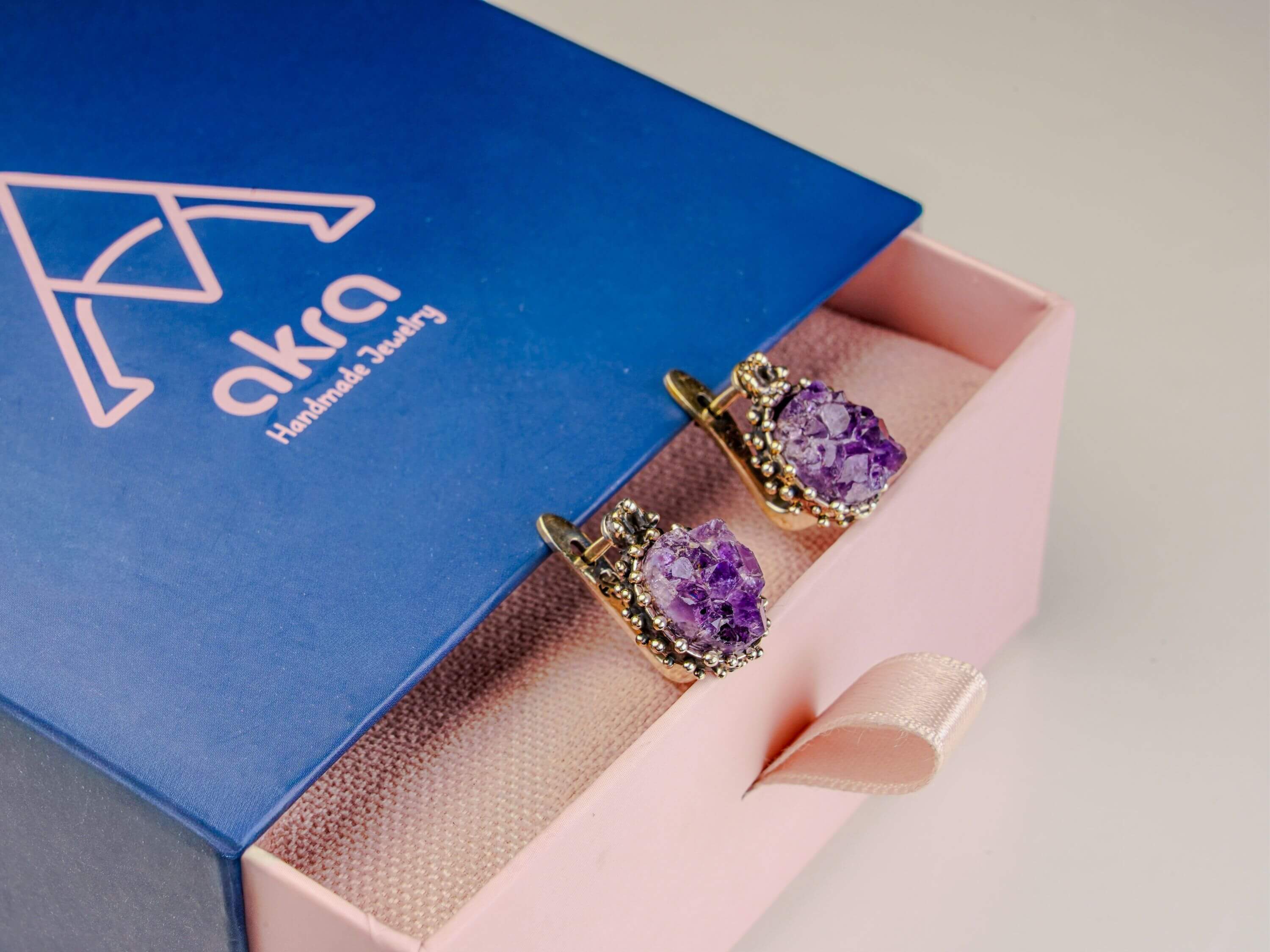 Amethyst earrings inside Akra Gems signature gift box, ready for premium gifting