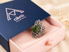 The green Jade statement ring presented in Akra Gems premium blue gift box, perfect for luxury gifting.