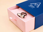 The raw Moonstone ring presented in Akra Gems' premium blue and pink signature gift box, ready for high-end gifting.