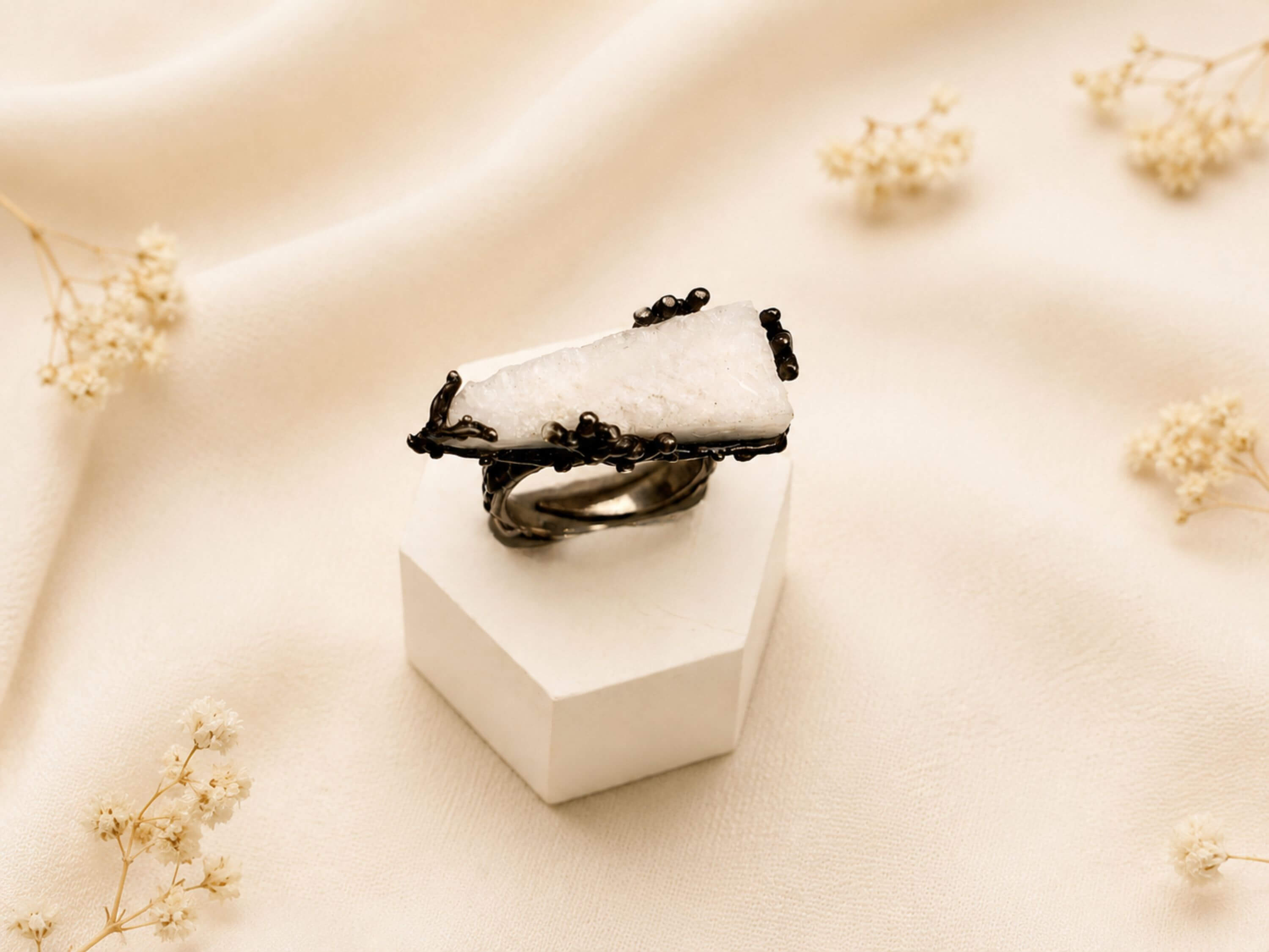 Handcrafted Moonstone jewelry by Akra Gems, showcasing the fusion of raw natural elements and bold artisan metalwork.