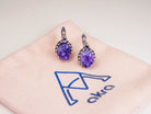 Artistic lifestyle shot of purple amethyst jewelry, capturing its mystical and sophisticated nature-inspired vibe