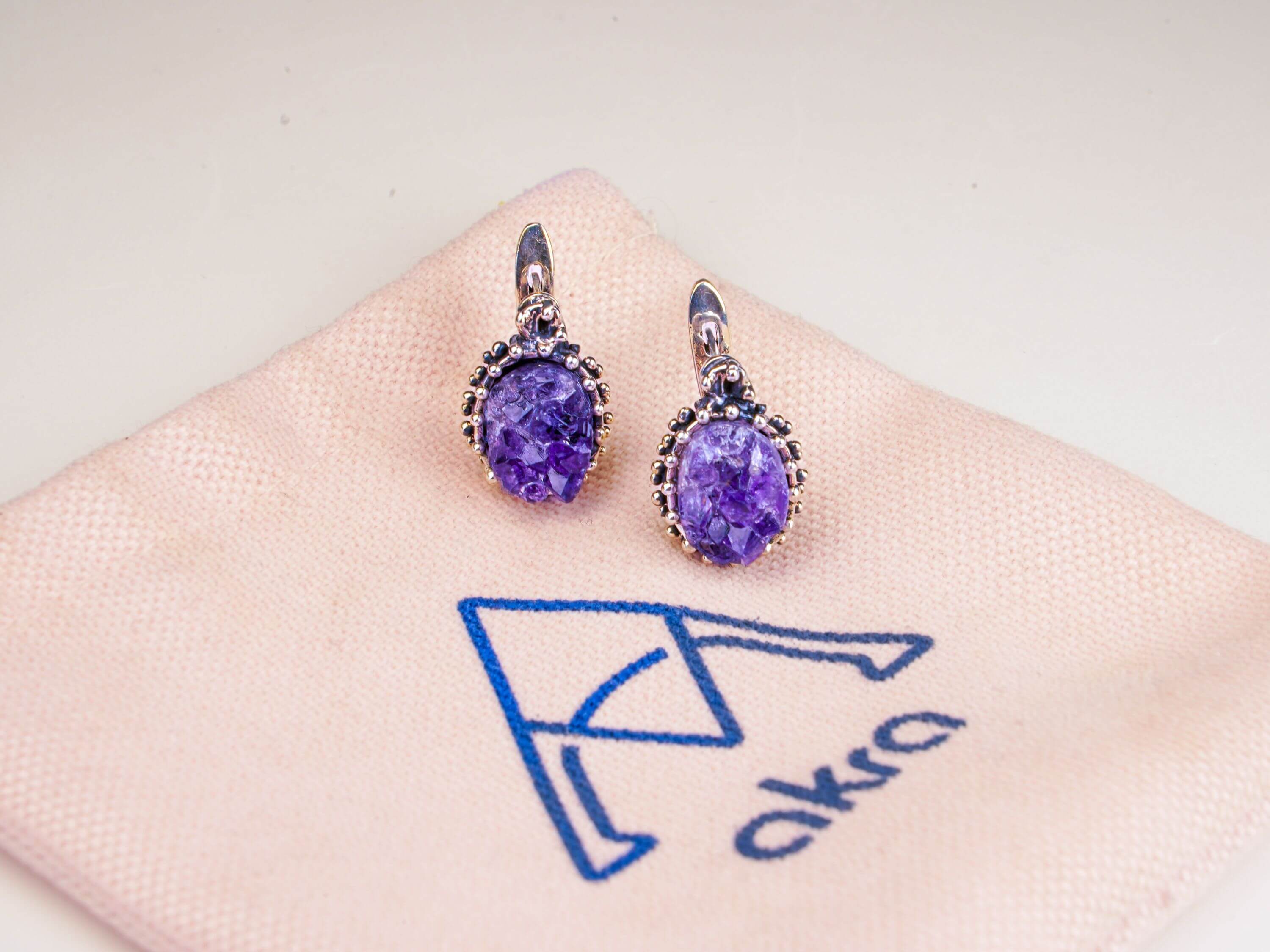 Artistic lifestyle shot of purple amethyst jewelry, capturing its mystical and sophisticated nature-inspired vibe