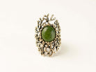 Direct front view of the green Jade ring, illustrating the symmetrical beauty of the stone and its powerful presence as a statement piece.