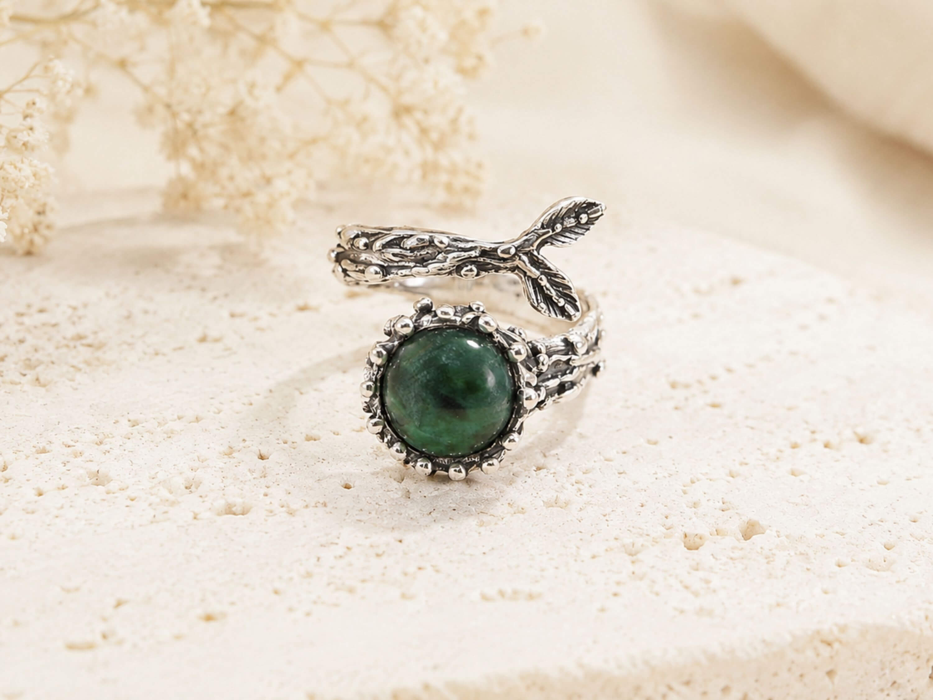 Top-down view of the Jade gemstone ring, emphasizing the unique, one-of-a-kind shape of the natural raw crystal.