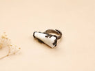 Front-facing view of the raw crystal ring, highlighting the asymmetrical, one-of-a-kind shape of the natural moonstone.