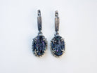 Front-facing symmetrical shot of the tourmaline earrings, emphasizing the contrast between the dark stone and the detailed oxidized silver