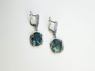 Natural labradorite earrings styled with a vintage aesthetic, emphasizing the mystical blue glow  