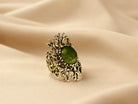 Artistic shot of the Jade ring on a soft fabric background, capturing its earthy and sophisticated nature-inspired design.