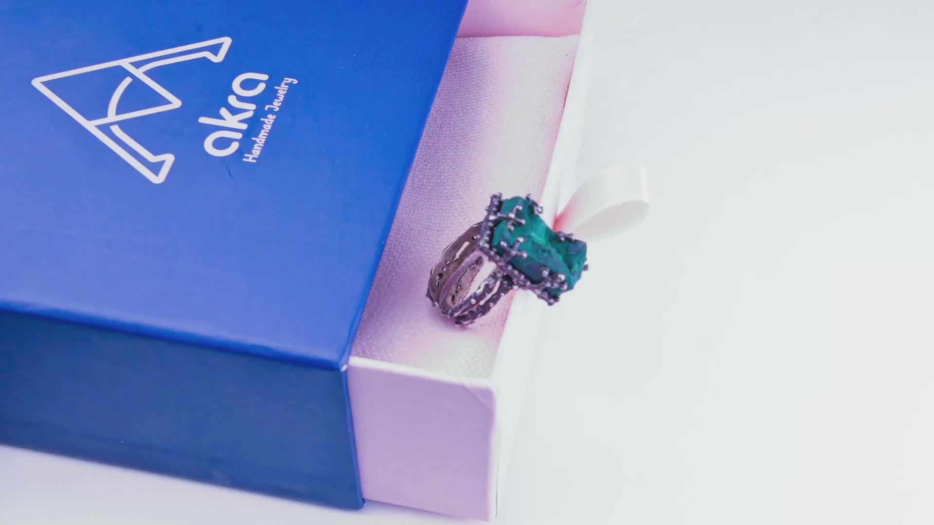 Cinematic 4K video showcase of the adjustable malachite ring showing gemstone shimmer and silver details