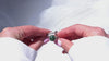 360-degree product video showcasing the raw green Jade gemstone and the intricate sterling silver branch design of the adjustable statement ring as it catches the light.
