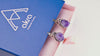 Product video capturing the natural shimmer of raw amethyst crystals and the elegant movement of the sterling silver oval dangles