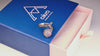 Slow-motion video of the rose quartz adjustable ring catching the light to show gemstone clarity and silver branch details