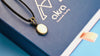 moonstone pendant necklace in sterling silver, natural white gemstone soft glow and movement