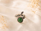 Handcrafted raw green Jade statement ring in a textured sterling silver setting, displayed on a neutral background.