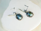 Side profile of blue flash labradorite earrings, highlighting the depth of the natural stone